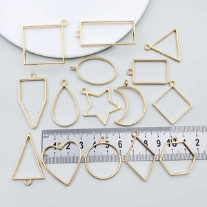 Golden alloy geometric pendant frames in moon and heart shapes for DIY jewelry making