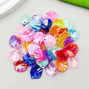 Macro shot of colorful iridescent acrylic cabbage leaf pendants for DIY jewelry making