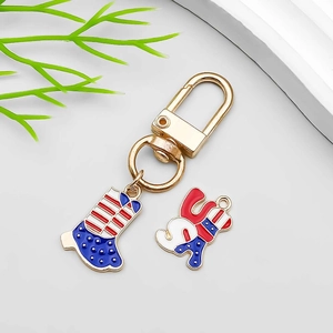 Detail view of USA flag enamel charms with patriotic cowboy boot on a gold lobster clasp