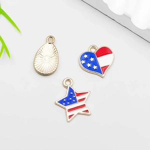 Macro detail of USA flag pendants in heart and star shapes for DIY jewelry making
