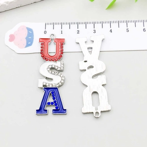 Detailed view of USA letter pendant with blue and white enamel and rhinestones for DIY