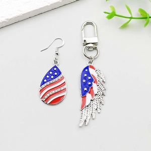 Close-up of American flag drip oil wing and teardrop charms with inlaid rhinestones