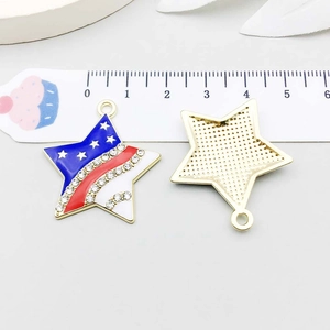 Detail of star-shaped American flag pendant with rhinestones and grid texture back