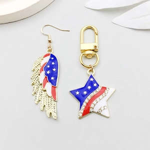 Detailed macro view of American flag star keychain and wing earring with enamel and rhinestones