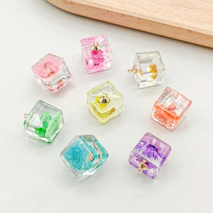 Handmade luminous resin cube pendants with real dried flowers and golden metal rings