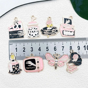 Pink and gold enamel Halloween charms collection with gramophone and retro motifs