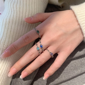 Lot de quatre bagues chaîne en argent S925 avec émeraudes et zircons bleus pour femme