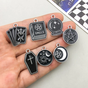 Gothic mystic alloy pendants set with tarot motifs including crystal ball and magic book