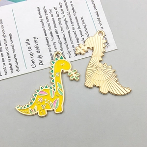 Detail showing front and back of cartoon dinosaur enamel pendant with floral patterns