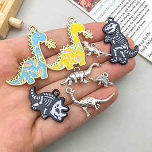 Assorted enamel dinosaur pendants in blue, yellow, and black for DIY jewelry making