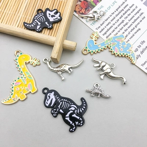 Cartoon dinosaur charms for jewelry making featuring colorful enamel and silver skeletons
