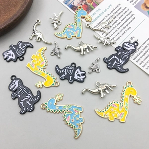 Detailed macro view of colorful enamel dinosaur pendants for DIY jewelry making and crafts