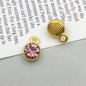 Macro detail of lavender gemstone pendant with golden edge and textured back
