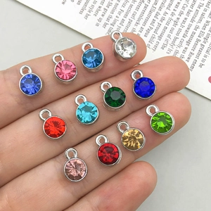 Twelve colorful crystal alloy pendants with silver frames for DIY jewelry making
