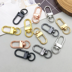 Detailed view of metal swivel lobster clasps in gold, silver, rose gold and black colors