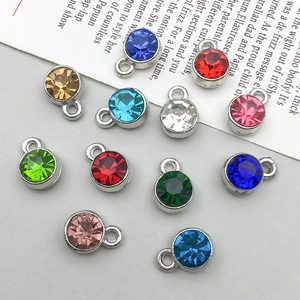 Macro view of colorful crystal star charms with silver alloy frames for DIY jewelry