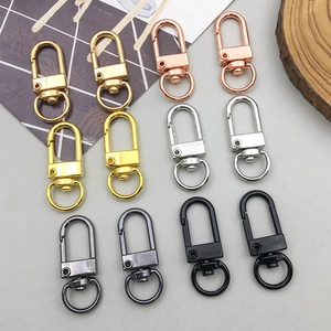 Detail of colorful swivel lobster clasps in gold, rose gold and silver finishes