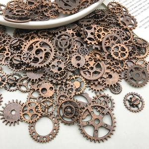 Detailed view of assorted antique bronze steampunk gears and mechanical metal pendants