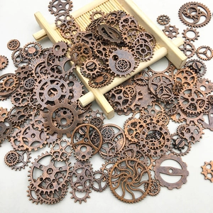 Macro shot of assorted bronze gear charms for steampunk DIY jewelry and crafts