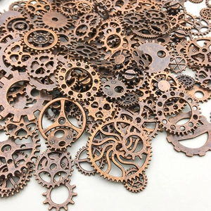 Detailed pile of assorted antique bronze steampunk gears for DIY jewelry and crafts
