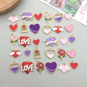 Detailed grid view of 24 colorful enamel heart and rose charms for DIY jewelry making