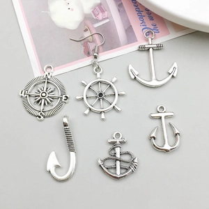 Antique silver nautical charm set featuring compass, anchor and rudder pendants for DIY jewelry