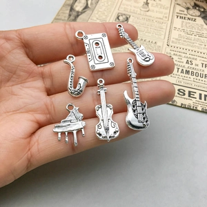 Antique silver musical instrument charms including guitar and violin for DIY jewelry