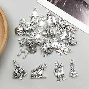 Detailed view of silver alloy Santa Claus charms for DIY jewelry making sets