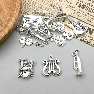 Detailed retro silver alloy music charms featuring guitar, violin and saxophone
