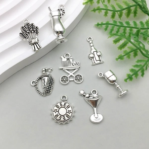 Detail of vintage silver wine-themed alloy charms including wine glass and beer bottle