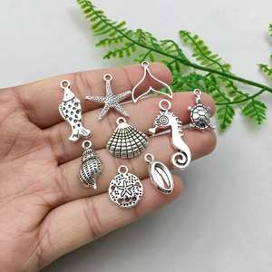 Antique silver alloy ocean theme pendants set featuring seahorse dolphin and starfish