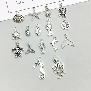 Detailed collection of antique silver ocean charms including seahorse, turtle and starfish