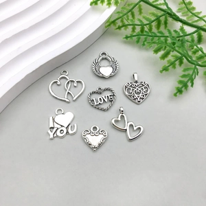 Detailed collection of antique silver hollow heart charms for DIY jewelry making