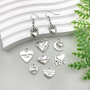 Silver alloy hollow heart and moon charms featuring romantic engraved love messages