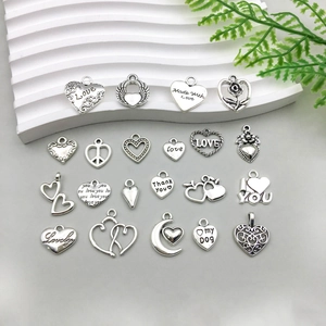 Collection of antique silver heart charms in various patterns for DIY jewelry making