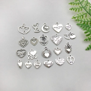 Detailed set of 20 silver alloy heart and moon pendants for DIY jewelry making