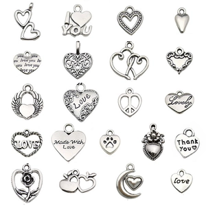 Variety of antique silver alloy heart pendants with engraved patterns and cutouts