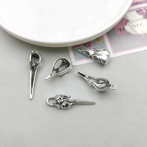 Detailed set of 5 vintage silver alloy bird skull pendants for DIY jewelry making