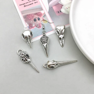 Antique silver bird skull pendant set with realistic bone texture for DIY jewelry making