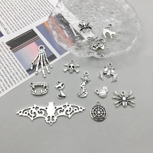 Detailed macro view of antique silver alloy Halloween charms for DIY jewelry making