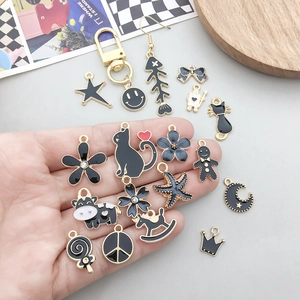 Assorted black enamel and gold alloy charms with animal shapes for DIY jewelry