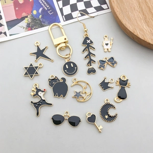 Assorted black enamel gold alloy charms featuring cats, stars, and moon for DIY jewelry