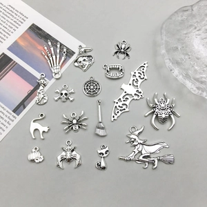 Macro view of assorted Halloween alloy charms with vintage silver finish and detailed textures