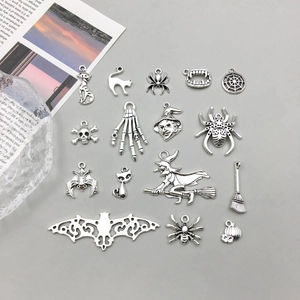 Detailed flat lay of assorted antique silver alloy Halloween charms for DIY jewelry making