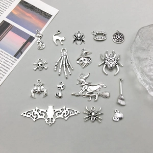 Collection of 17 vintage silver Halloween charms including bat and pumpkin for DIY jewelry