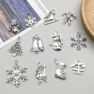 Set of 11 antique silver Christmas charms including snowflakes, bells and snowmen for DIY jewelry