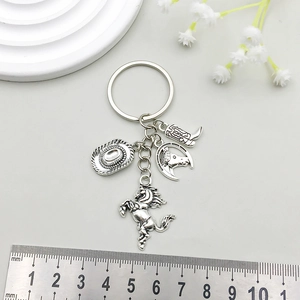 Antique silver Western cowboy hat keychain with boots and horse horseshoe charms