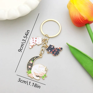 Porte-clés chat lune avec chats à taches de cœur et charm croissant de lune fleuri