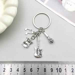 Antique silver music keychain with guitar, drum, and microphone charms for DIY accessories