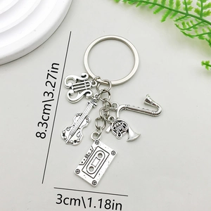 Antique silver music keychain with saxophone, violin and cassette charms, 8.3cm length